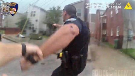 美国巴尔的摩警察与歹徒发生激烈枪战 防弹衣帮警察捡回一条命